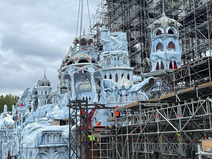 Tomorrowland Mainstage scenic towers mid-build, surrounded by scaffolding