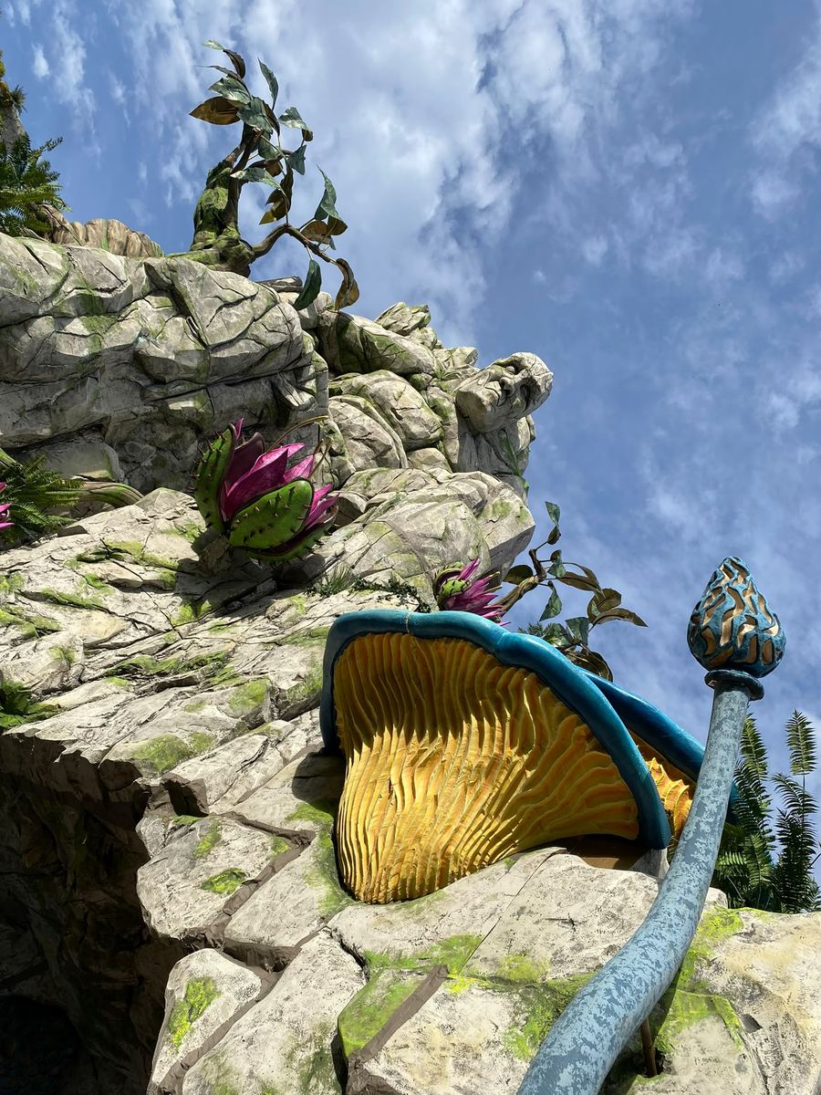 Sculpted rock and flower scenic decor detail