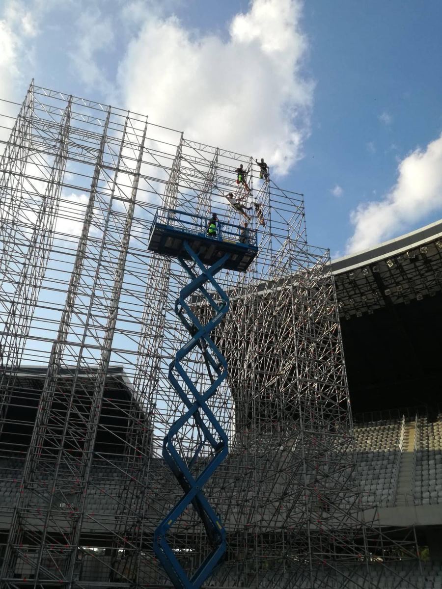 Robotic video towers rigged over a stadium pitch